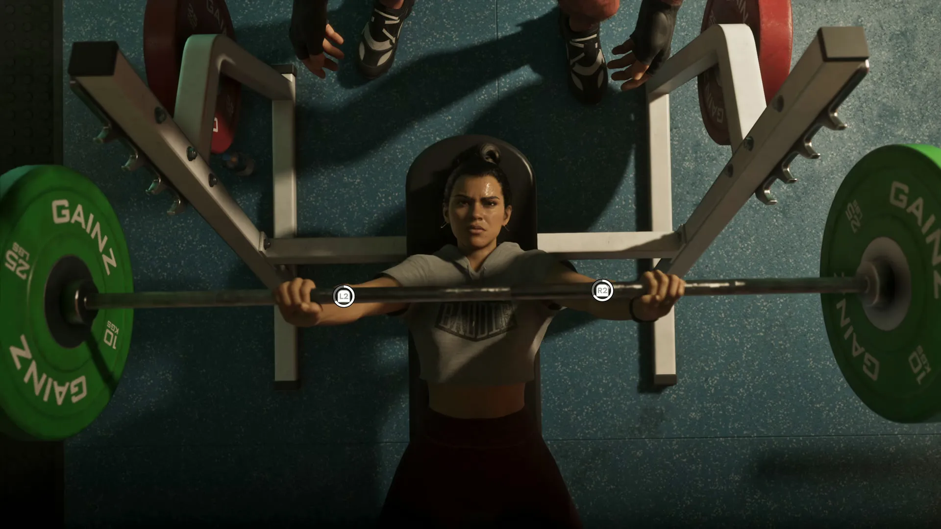 Lucia bench-presses a GAINZ barbell in a gym