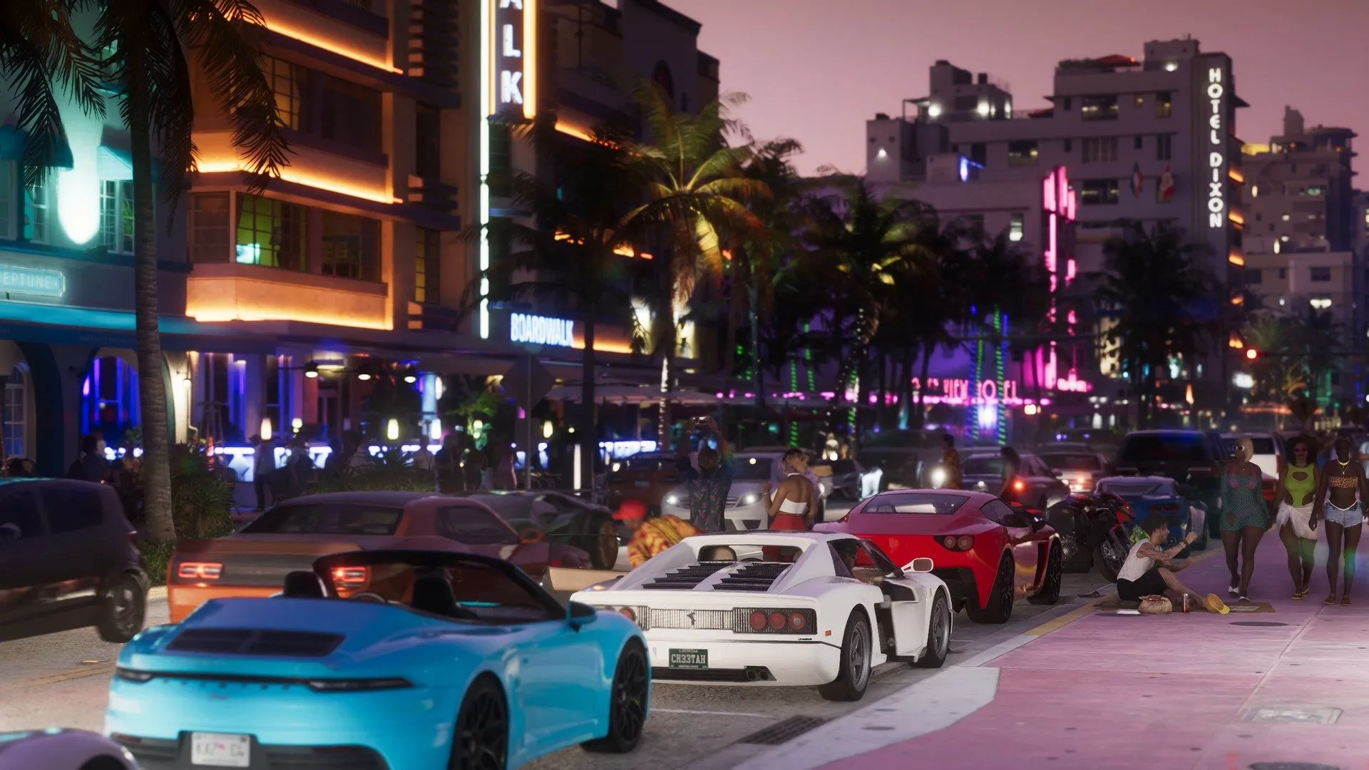 A night street lined with neon hotel signs and sports cars at the kerb